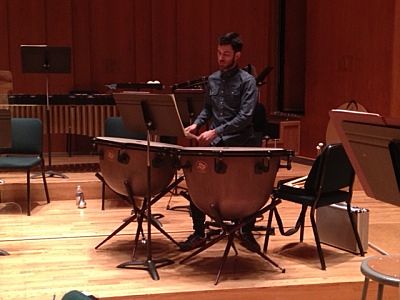 Associate Principal Timpanist, Eric Hopkins, warming up before rehearsal of Mozart’s Symphony #35 (the “Haffner”).